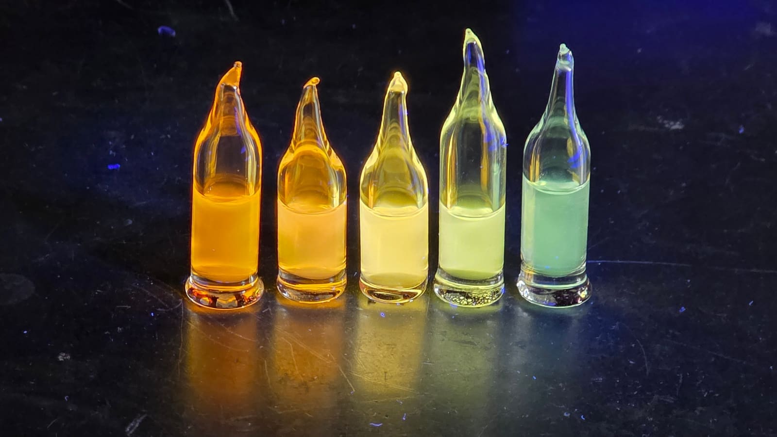 Synthesized Quantum Dots in Vials Under UV