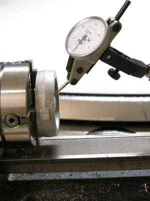 Indicating in the face of the flywheel to ensure it is perpedicular to the bore